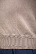 Woman wearing Country Laine - Cotton V Neck Cardigan (CL0093) in the colour Sand.