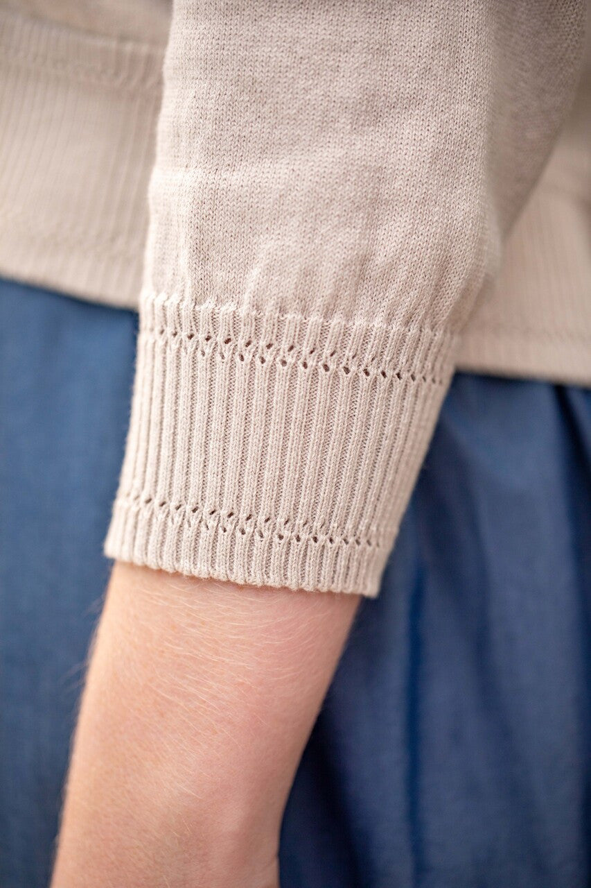 Woman wearing Country Laine - Cotton V Neck Cardigan (CL0093) in the colour Sand.