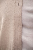 Woman wearing Country Laine - Cotton V Neck Cardigan (CL0093) in the colour Sand.