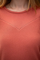 Woman wearing Country Laine - Cotton Eyelet Yoke Jumper (CL0094) in the colour Sienna.