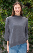 Woman wearing Country Laine - Slant Jumper (CL0115-IND2026) in the colour Dark Grey.