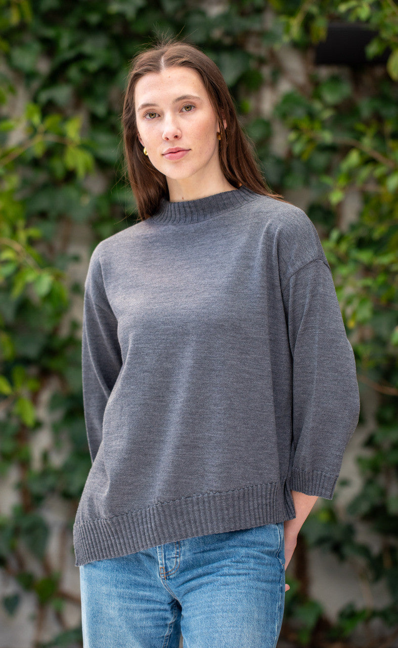 Woman wearing Country Laine - Slant Jumper (CL0115-IND2026) in the colour Dark Grey.