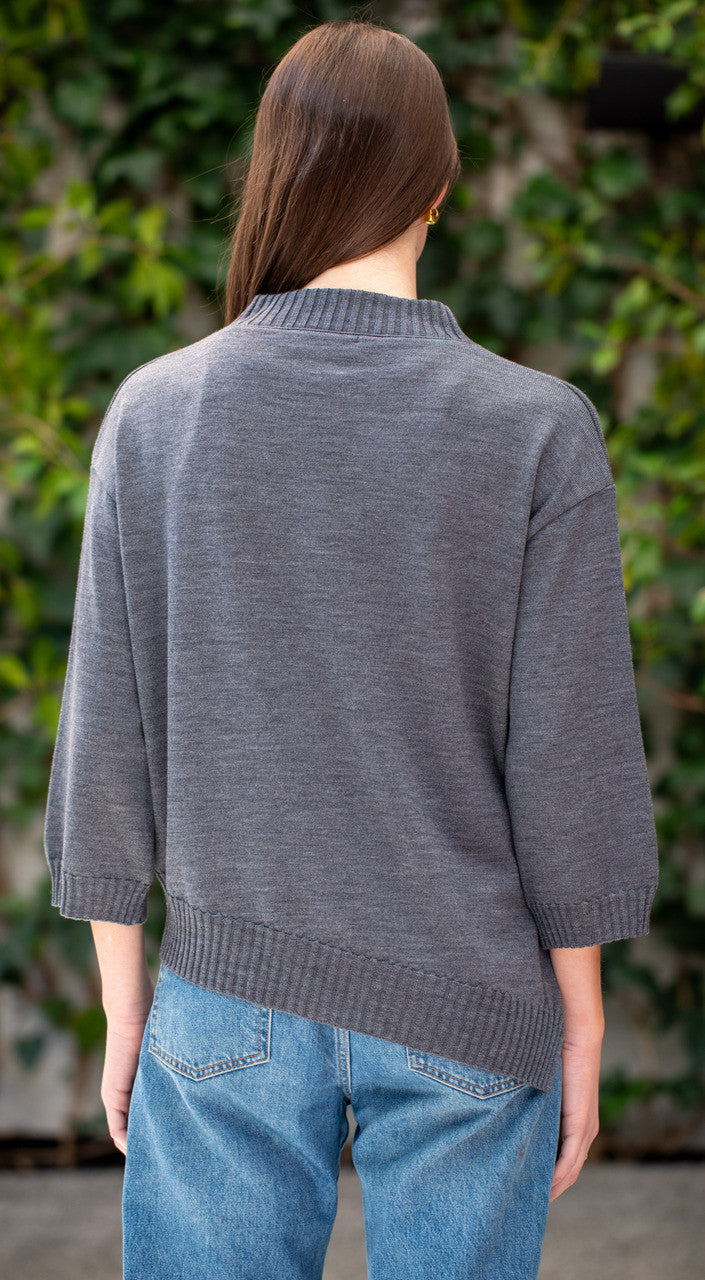 Woman wearing Country Laine - Slant Jumper (CL0115-IND2026) in the colour Dark Grey.