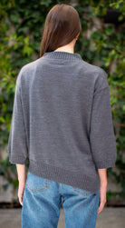 Woman wearing Country Laine - Slant Jumper (CL0115-IND2026) in the colour Dark Grey.