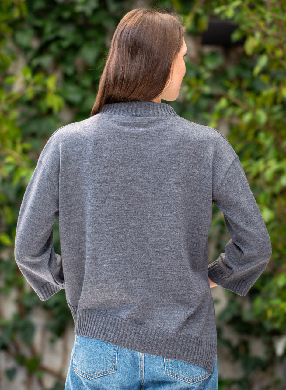 Woman wearing Country Laine - Slant Jumper (CL0115-IND2026) in the colour Dark Grey.