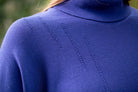 Woman wearing Country Laine - High Neck Sway Jumper (CL0122-IND2026) in the colour Atlantic.