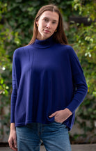Woman wearing Country Laine - High Neck Sway Jumper (CL0122-IND2026) in the colour Atlantic.