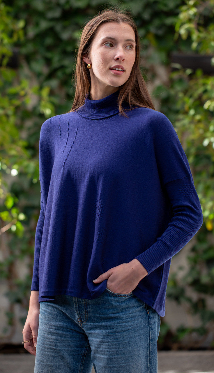 Woman wearing Country Laine - High Neck Sway Jumper (CL0122-IND2026) in the colour Atlantic.