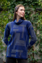 Woman wearing Country Laine -  Cubist Jumper (CL0123L-IND2026) in the colour Atlantic/Dark Grey.