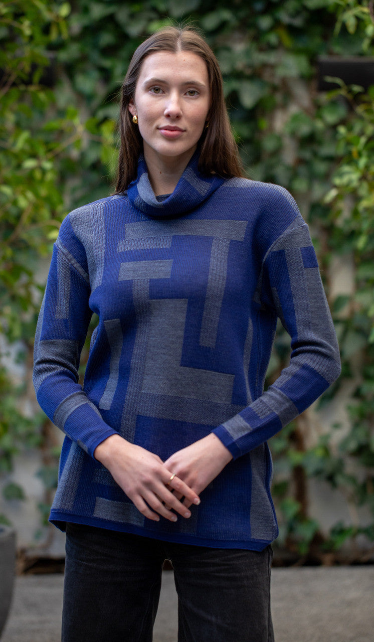 Woman wearing Country Laine -  Cubist Jumper (CL0123L-IND2026) in the colour Atlantic/Dark Grey.