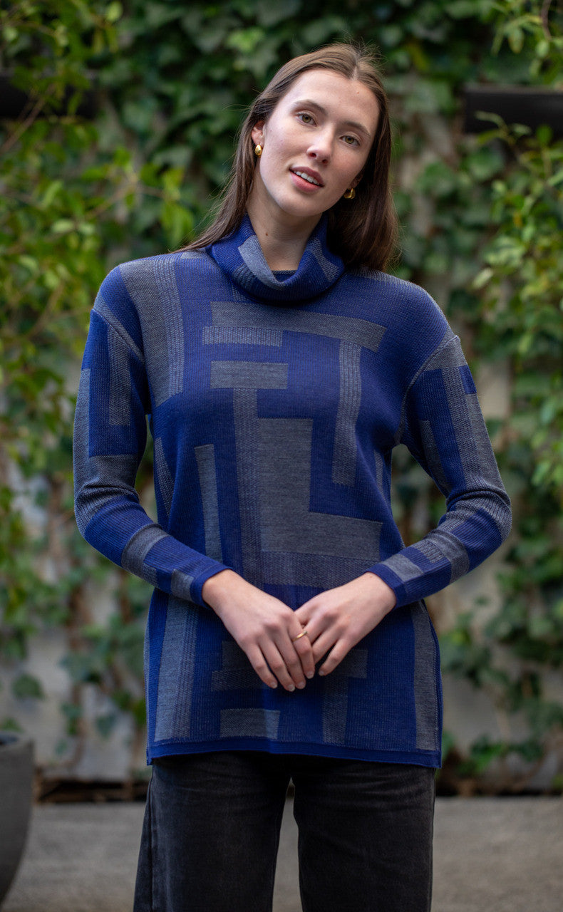 Woman wearing Country Laine -  Cubist Jumper (CL0123L-IND2026) in the colour Atlantic/Dark Grey.