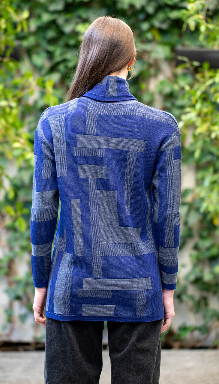 Woman wearing Country Laine -  Cubist Jumper (CL0123L-IND2026) in the colour Atlantic/Dark Grey.