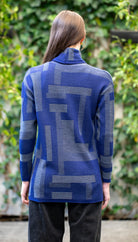 Woman wearing Country Laine -  Cubist Jumper (CL0123L-IND2026) in the colour Atlantic/Dark Grey.