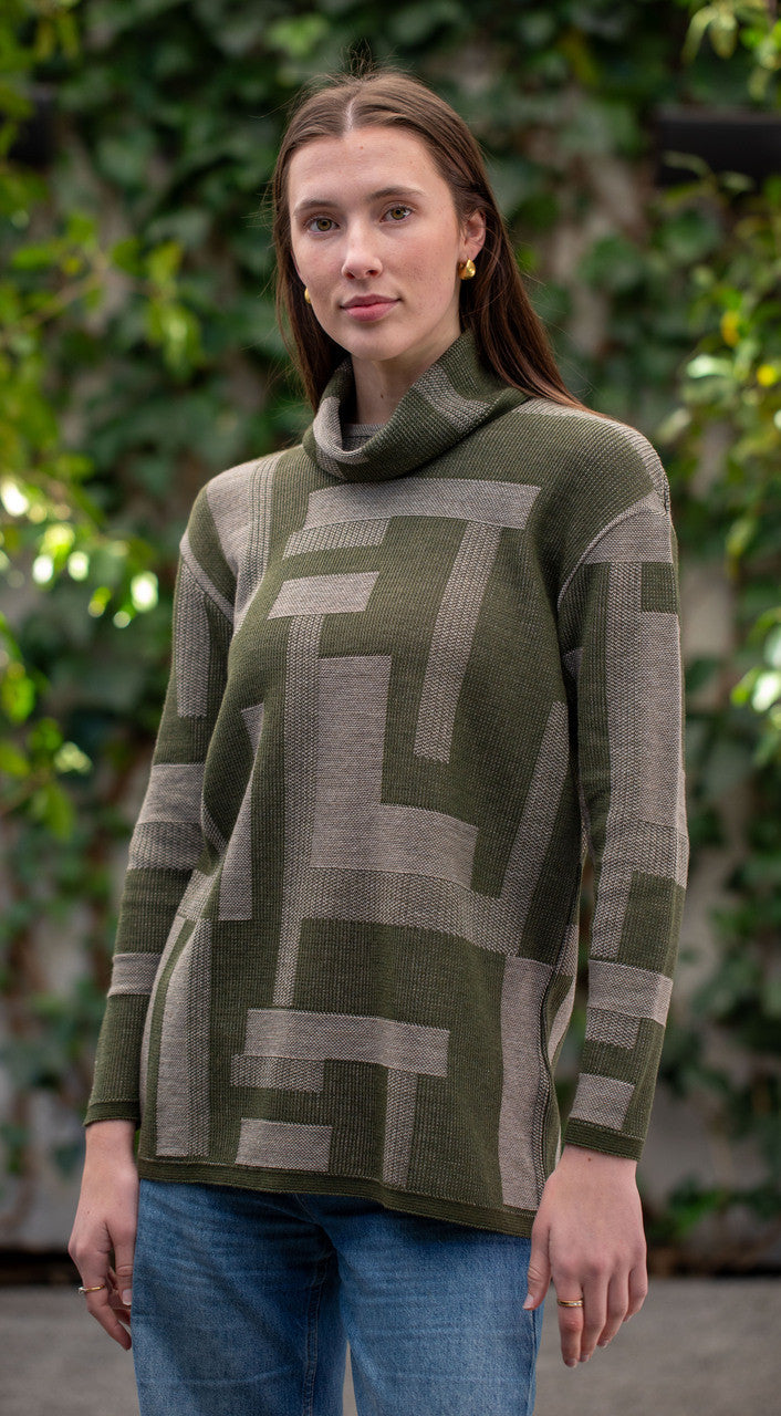 Woman wearing Country Laine -  Cubist Jumper (CL0123L-IND2026) in the colour Olive/Chateau.