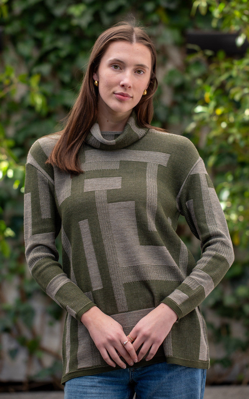 Woman wearing Country Laine -  Cubist Jumper (CL0123L-IND2026) in the colour Olive/Chateau.