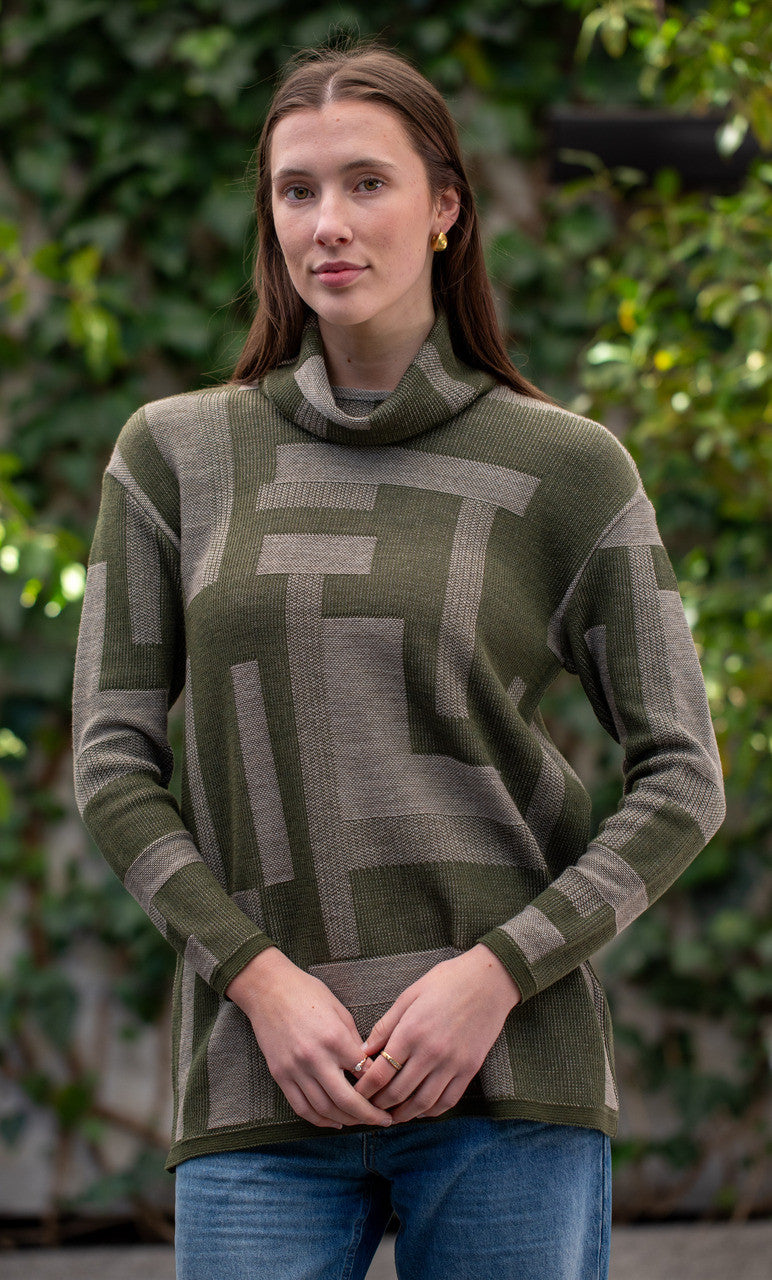 Woman wearing Country Laine -  Cubist Jumper (CL0123L-IND2026) in the colour Olive/Chateau.
