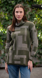 Woman wearing Country Laine -  Cubist Jumper (CL0123L-IND2026) in the colour Olive/Chateau.