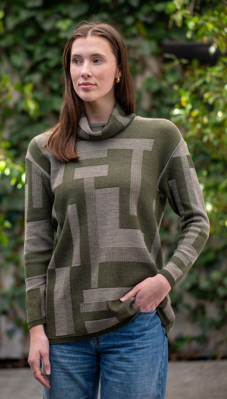 Woman wearing Country Laine -  Cubist Jumper (CL0123L-IND2026) in the colour Olive/Chateau.