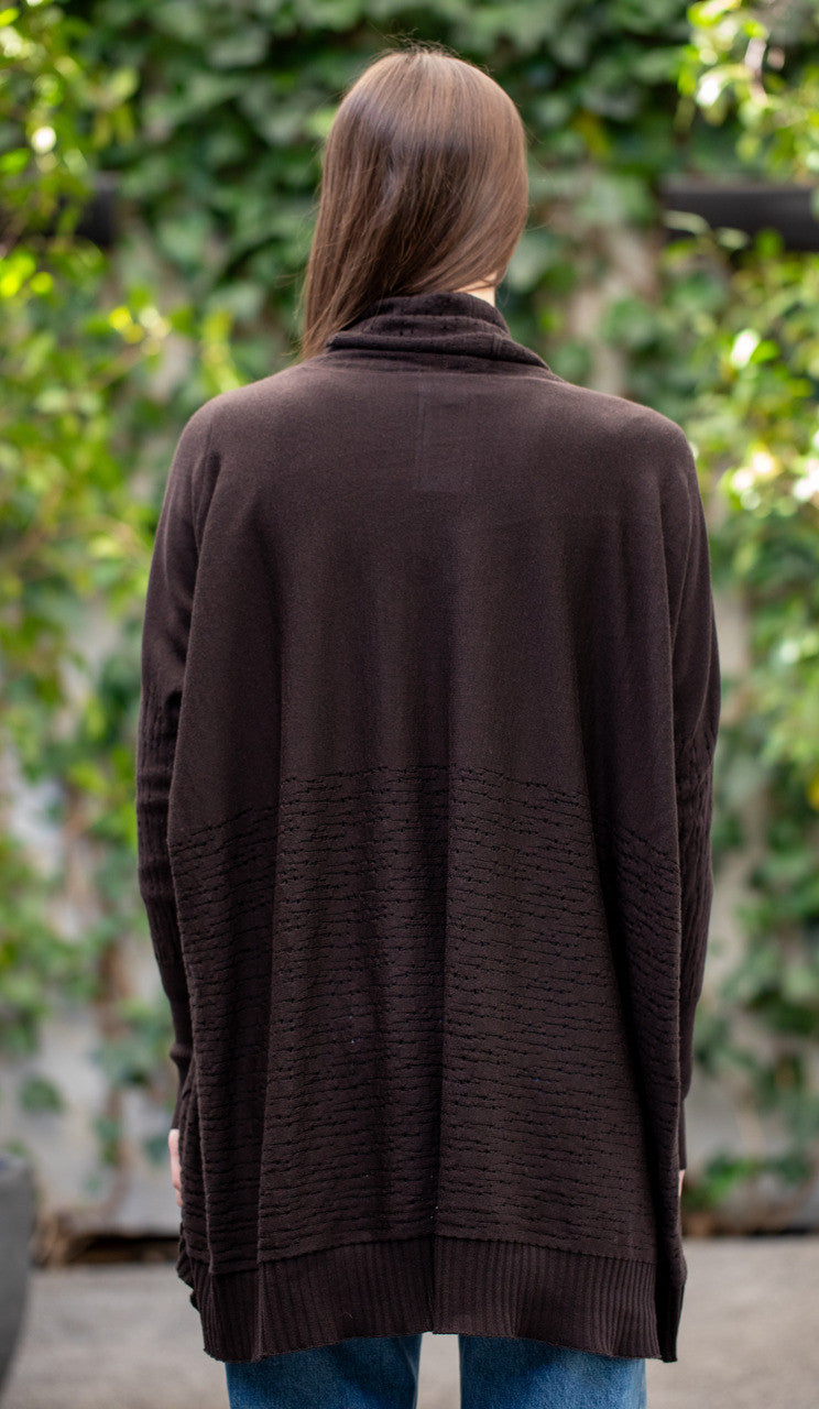 Woman wearing Country Laine - The Nest Top (CL0130-IND2026) in the colour Chocolate.