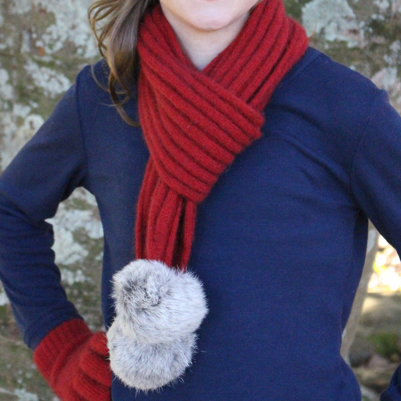 Girl wearing red colour scarf.