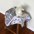 Baby cot blanket in colour silver and off white.