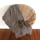 Fawn-coloured Knight Mohair Throw draped over chair.