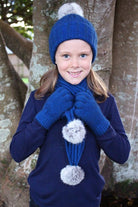 Child wearing matching beanie, scarf and gloves. Colour Lagoon