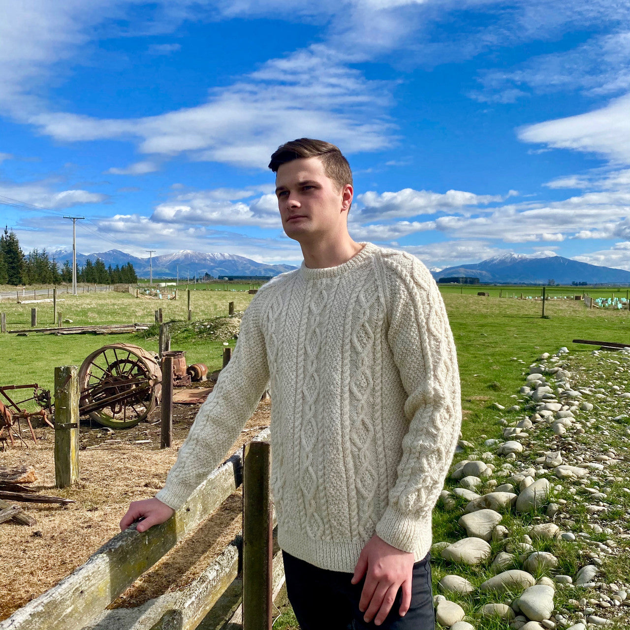 Man wearing Lesley Unisex Aran Wool sweater in the colour Cream.