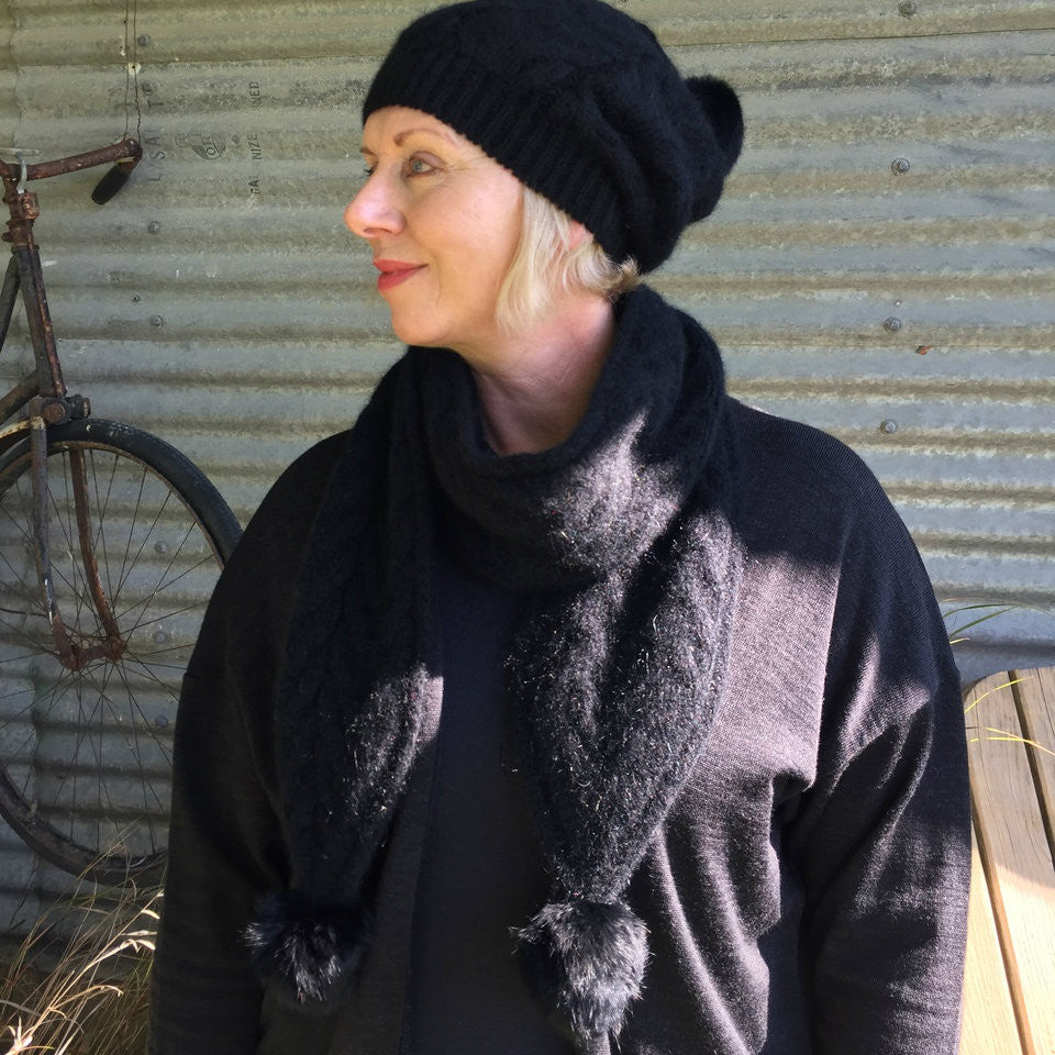 Black-Woman wearing black outfit with black beanie