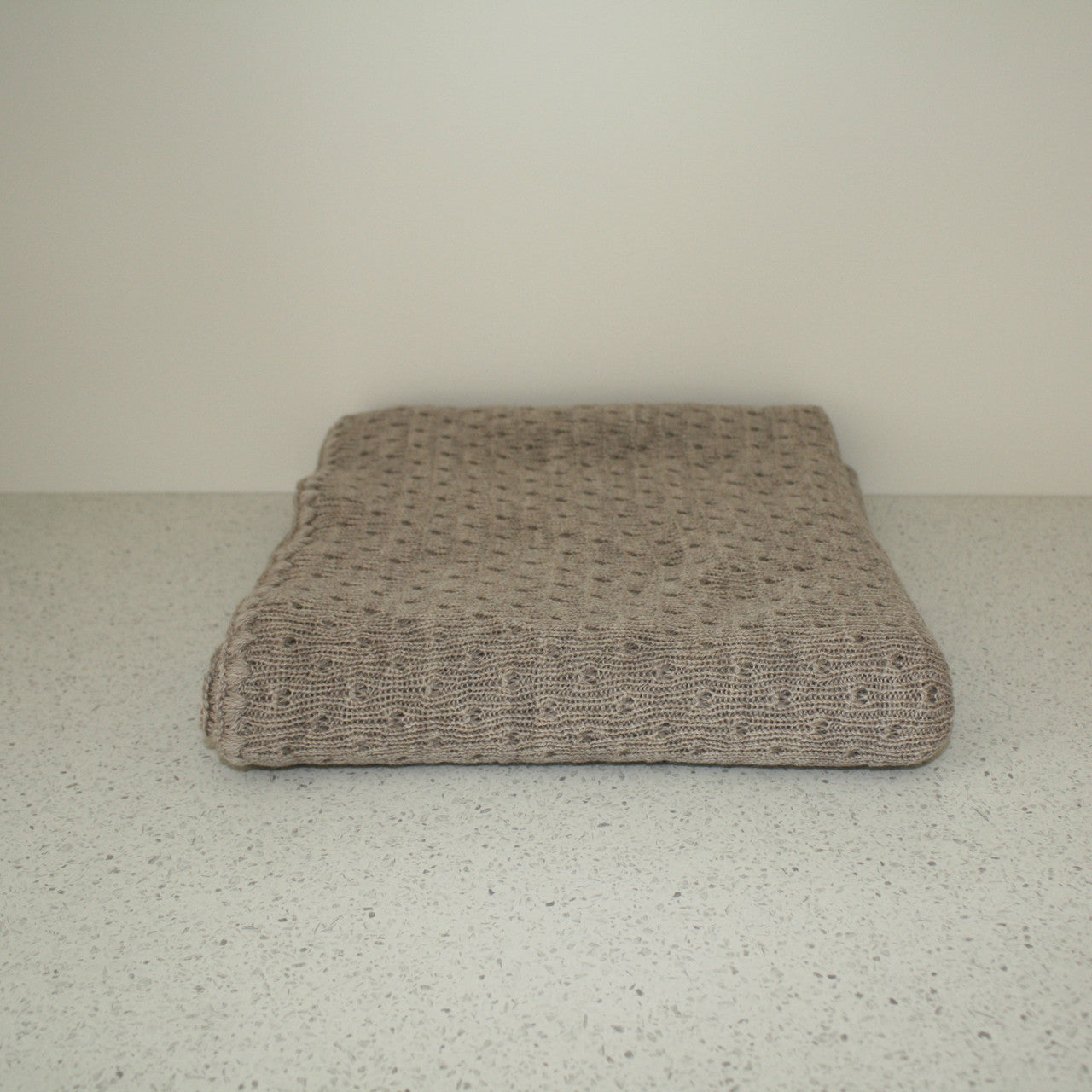 Bauge coloured baby eyelet blanket.