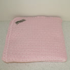 Pink coloured baby blanket.