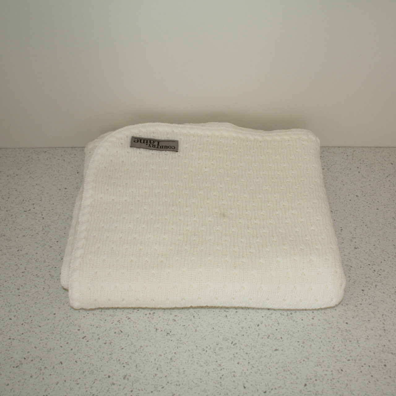 White coloured baby blanket.