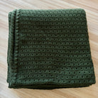 Moss coloured baby blanket.