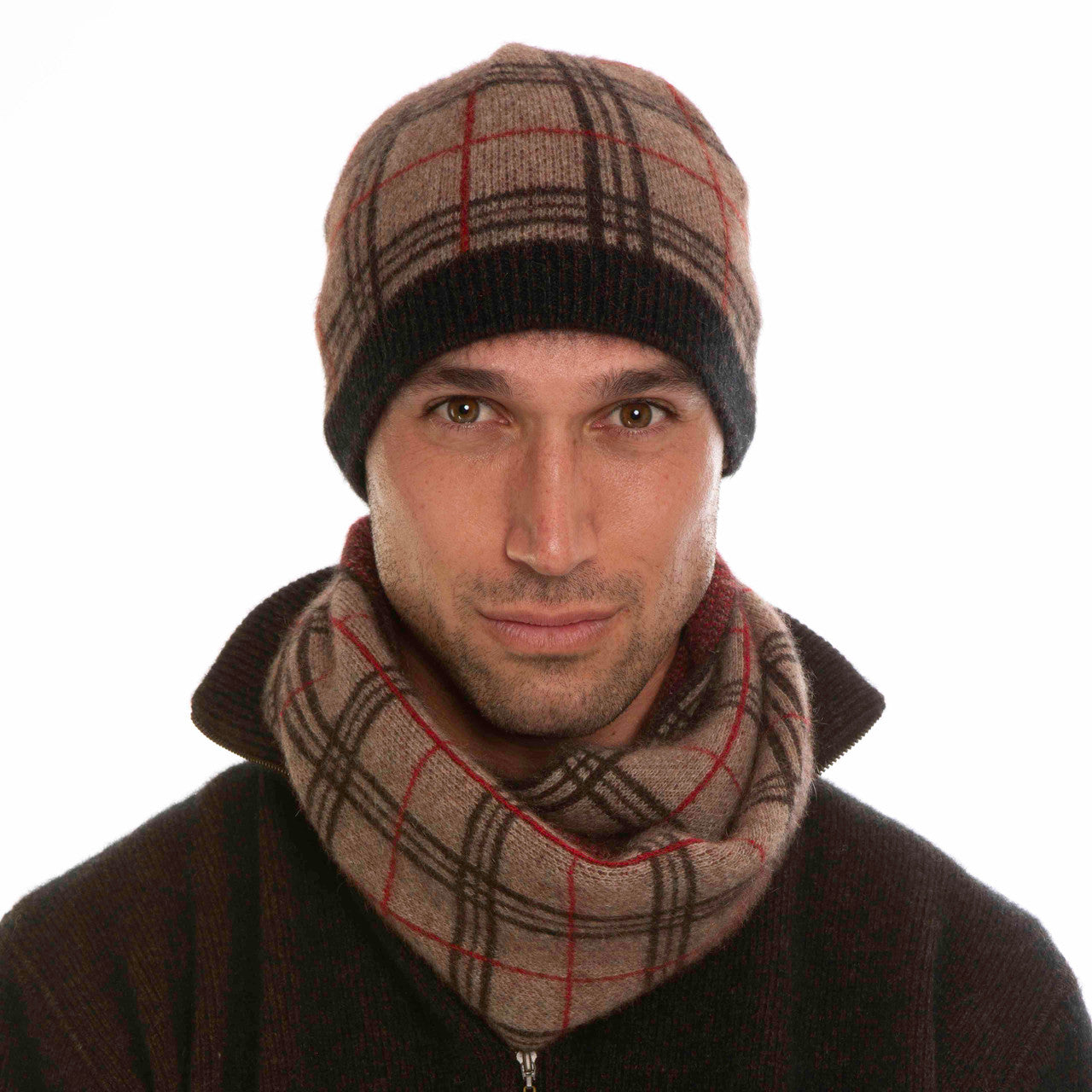 A man wearing a mocha, espresso, and rata-coloured Koru merino and possum Tartan Scarf.