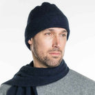 A man wearing an Navy-coloured Koru Merino and Possum Plain Beanie.