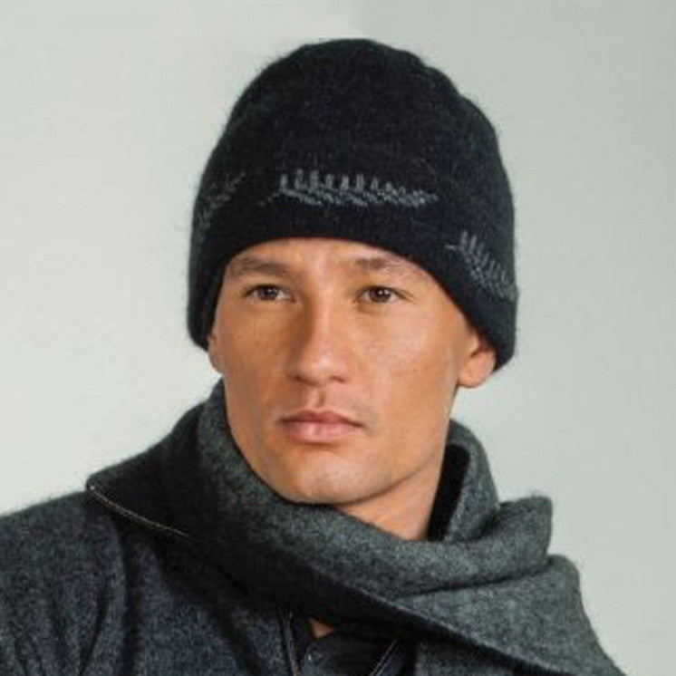 Man wearing a black-coloured Koru merino and possum NZ Supporters Silver Fern Beanie.