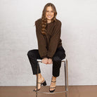 Woman wearing Noble Wilde - Merino & Possum Bellow Sleeve Top in the colour Tobago.