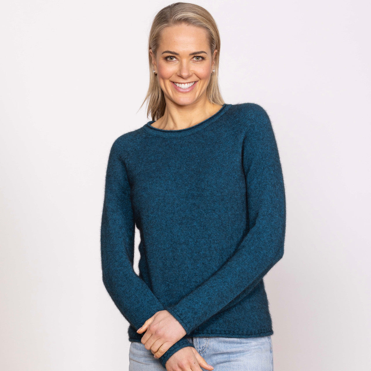 Woman wearing Noble Wilde - Merino and Possum Rutland Raglan Crew (NW3228) in the colour Tui.
