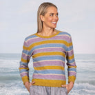 Woman wearing the Cara Crew in the colour Ochre Base.