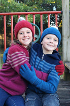Girl wearing fuchsia colour striped hoodie hugging boy wearing lagoon colour striped hoodie.