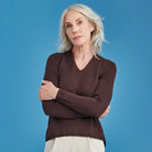 Woman wearing Royal Merino - Long Sleeve Classic High Vee (RM2050HV) in the colour Earth.
