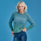 Woman wearing Royal Merino - Flourish Jumper (RM3037) in the colour Green Tea/Cornflower