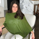 Woman wearing cotton poncho. Colour Fern