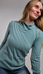 Woman wearing Country Laine - Merino Swirl Jumper in the colour Opal.