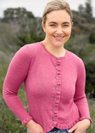 Woman wearing Royal Merino - Frill Trim Cardigan (RM2396) in the colour Azalea.