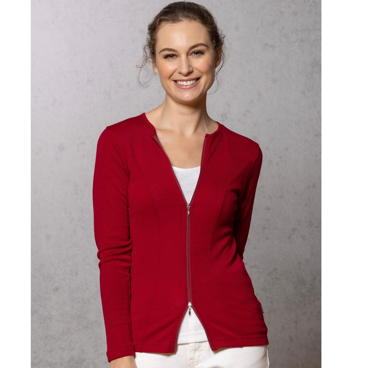 Woman wearing zipped Catherine Cardigan in Portobello