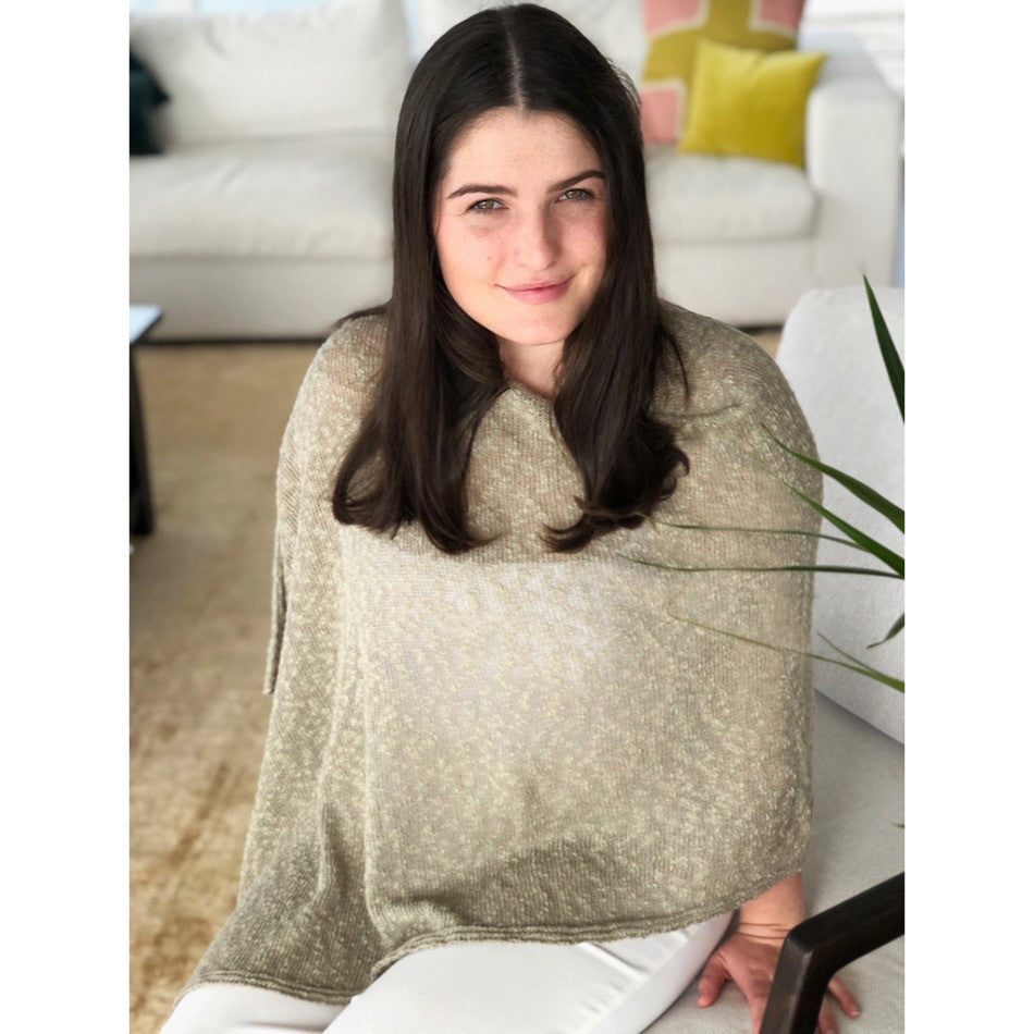 Woman wearing cotton poncho. Colour Stone