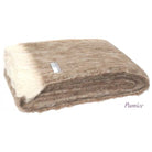 Folded Alpaca fleece throw in Pumice colour.