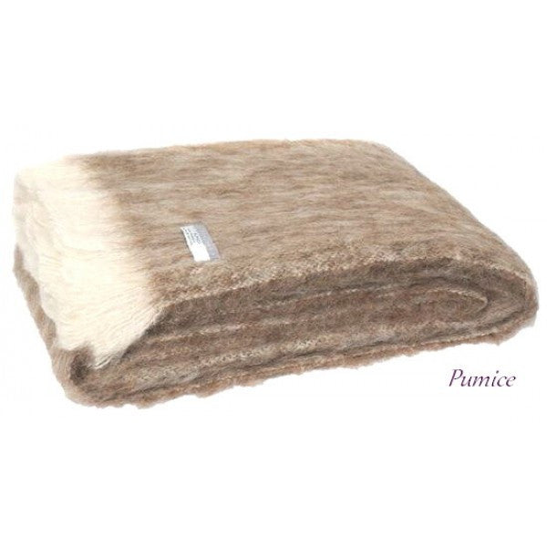 Folded Alpaca fleece throw in Pumice colour.