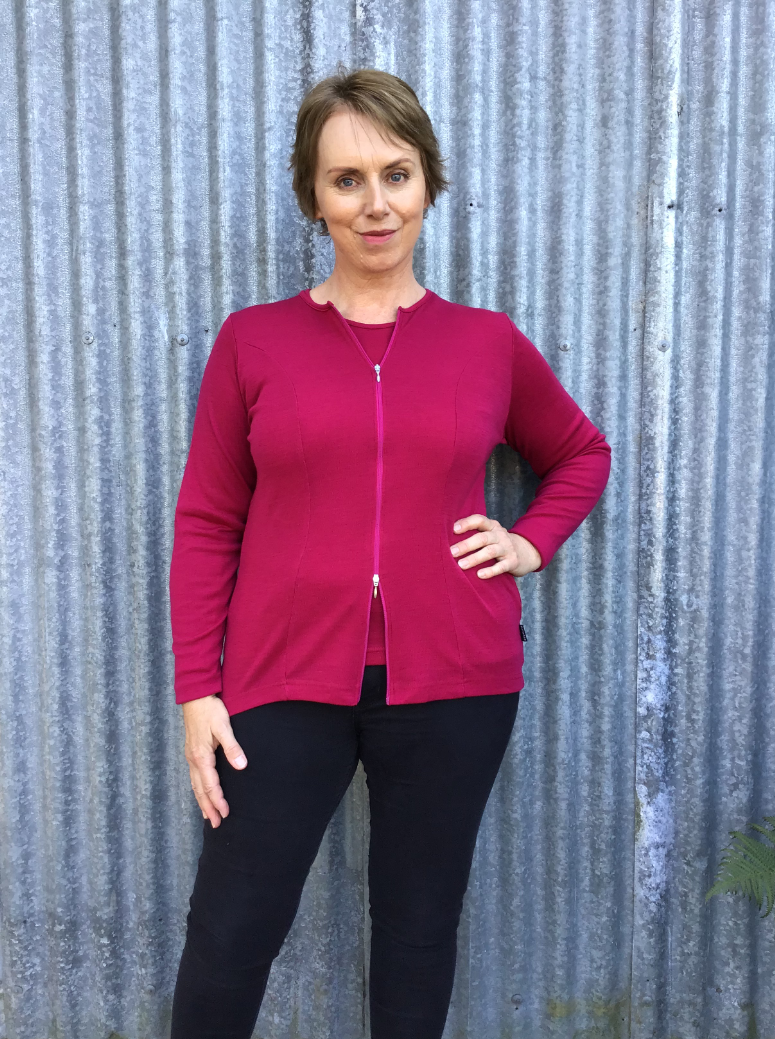 Woman wearing zipped Catherine Cardigan in Cerise